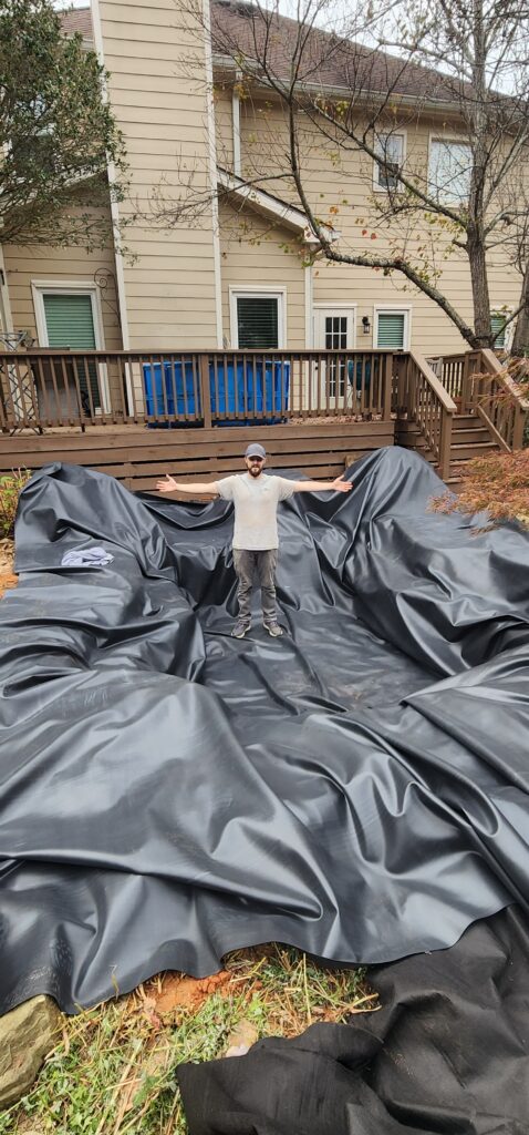 Michael standing on freshly laid liner. 